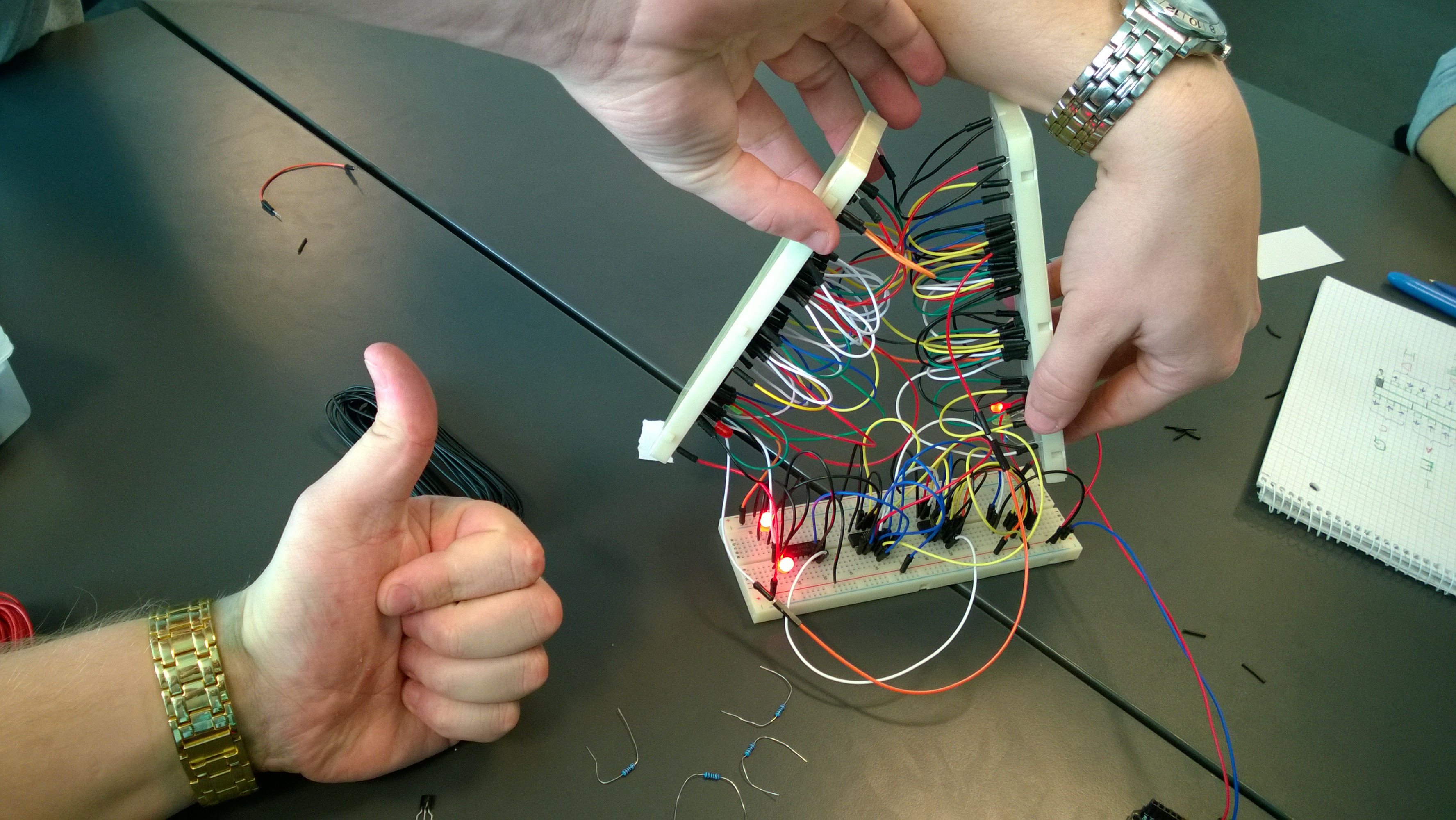 A happy group showing off a 3 bit NAND gate