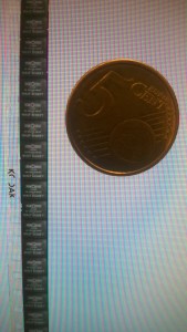 8mm film and a 5 cent coin